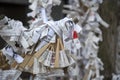 Japanease Omikuji random fortunes paper tied to rope wire for good luck at Namba Yasaka Shrine in Osaka, Japan Royalty Free Stock Photo