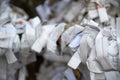 Japanease Omikuji random fortunes paper tied to rope wire for good luck at Namba Yasaka Shrine in Osaka, Japan Royalty Free Stock Photo