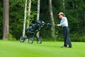 Japaneese golfer finishes his swing