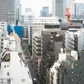 Japanese abstract urban background featuring details of chaotic city buildings and skyline in Tokyo