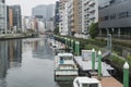 Japanese abstract urban background featuring details of chaotic city buildings and urban water front Royalty Free Stock Photo