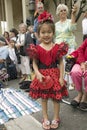 Japanese American girl is in bright red Mexican dress at annual Old Spanish Days Fiesta held every August in Santa Barbara