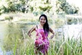 Japanese American Woman At River Smiling In Floral Dress Royalty Free Stock Photo