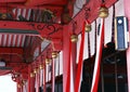 Japanese architectural decorative items with bells and red cloth