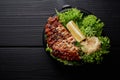 Japanese or asian cuisine. Salad with grilled meat or fish with lettuche, lemon and ginger Royalty Free Stock Photo