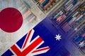 The Japanese and Australian flags imposed over shipping containers representing trade between the two countries. With a grainy, gr Royalty Free Stock Photo