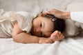 Japanese Baby Daughter Lying While Mom Stroking Her Head Indoor Royalty Free Stock Photo