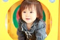 Japanese baby girl passing through a tunnel Royalty Free Stock Photo