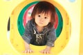 Japanese baby girl passing through a tunnel Royalty Free Stock Photo