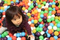 Japanese baby girl playing in ball pool Royalty Free Stock Photo