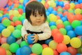 Japanese baby girl playing in ball pool Royalty Free Stock Photo