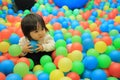 Japanese baby girl playing in ball pool Royalty Free Stock Photo