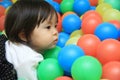 Japanese baby girl playing in ball pool Royalty Free Stock Photo
