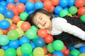 Japanese baby girl playing in ball pool Royalty Free Stock Photo