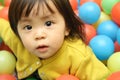 Japanese baby girl playing in ball pool Royalty Free Stock Photo