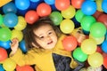 Japanese baby girl playing in ball pool Royalty Free Stock Photo