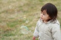 Japanese baby girl playing with bubble Royalty Free Stock Photo