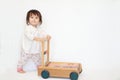 Japanese baby girl pushing a cart Royalty Free Stock Photo