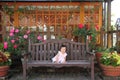 Japanese baby girl sitting on the bench Royalty Free Stock Photo