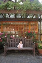 Japanese baby girl sitting on the bench Royalty Free Stock Photo