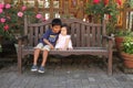 Japanese baby girl sitting on the bench Royalty Free Stock Photo