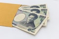 Japanese banknote 1,000 yen in brown envelope for give and business success and shopping. Royalty Free Stock Photo