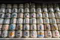 Japanese Barrels of Sake wrapped in Straw stacked on shelf