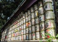 Japanese Barrels of Sake wrapped in Straw stacked on shelf Royalty Free Stock Photo