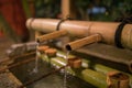 Japanese Basin, a tsukubai with bamboo ladles in the entrance of Yasaka Shrine in Kyoto, Japan Royalty Free Stock Photo