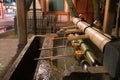 Japanese Basin, a tsukubai with bamboo ladles in the entrance of Yasaka Shrine in Kyoto, Japan Royalty Free Stock Photo