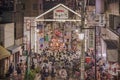 Japanese bear Shinto shrine mikoshi on their shoulders during the Obon festival in the retro old-fashionned shopping street Yanaka