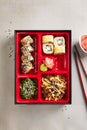 Japanese Bento Box with Sushi Rolls, Salad and Main Course Top V Royalty Free Stock Photo