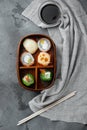 Japanese bento lunch box with chopsticks, on gray stone background, top view flat lay Royalty Free Stock Photo