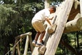 Japanese boy climbing on the wall Royalty Free Stock Photo