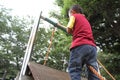 Japanese boy climbing on the wall Royalty Free Stock Photo