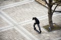 Japanese boy people play and riding skateboard in garden in Ariake town at Koto city in Tokyo, Japan