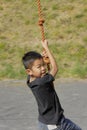 Japanese boy playing with flying fox Royalty Free Stock Photo