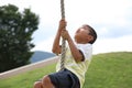 Japanese boy playing with flying fox Royalty Free Stock Photo