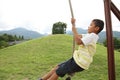 Japanese boy playing with flying fox Royalty Free Stock Photo