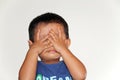 Japanese boy playing peek-a-boo Royalty Free Stock Photo