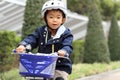 Japanese boy riding on the bicycle