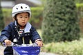 Japanese boy riding on the bicycle