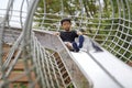 Japanese boy on the slide Royalty Free Stock Photo