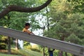 Japanese boy on the slide summer Royalty Free Stock Photo