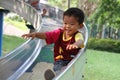 Japanese boy on the slide Royalty Free Stock Photo