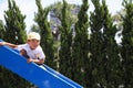 Japanese boy on the slide Royalty Free Stock Photo