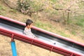 Japanese boy on the slide Royalty Free Stock Photo