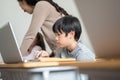 Japanese boy studying on laptop Royalty Free Stock Photo