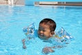 Japanese boy swiming in the pool Royalty Free Stock Photo