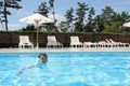 Japanese boy swiming in the pool Royalty Free Stock Photo